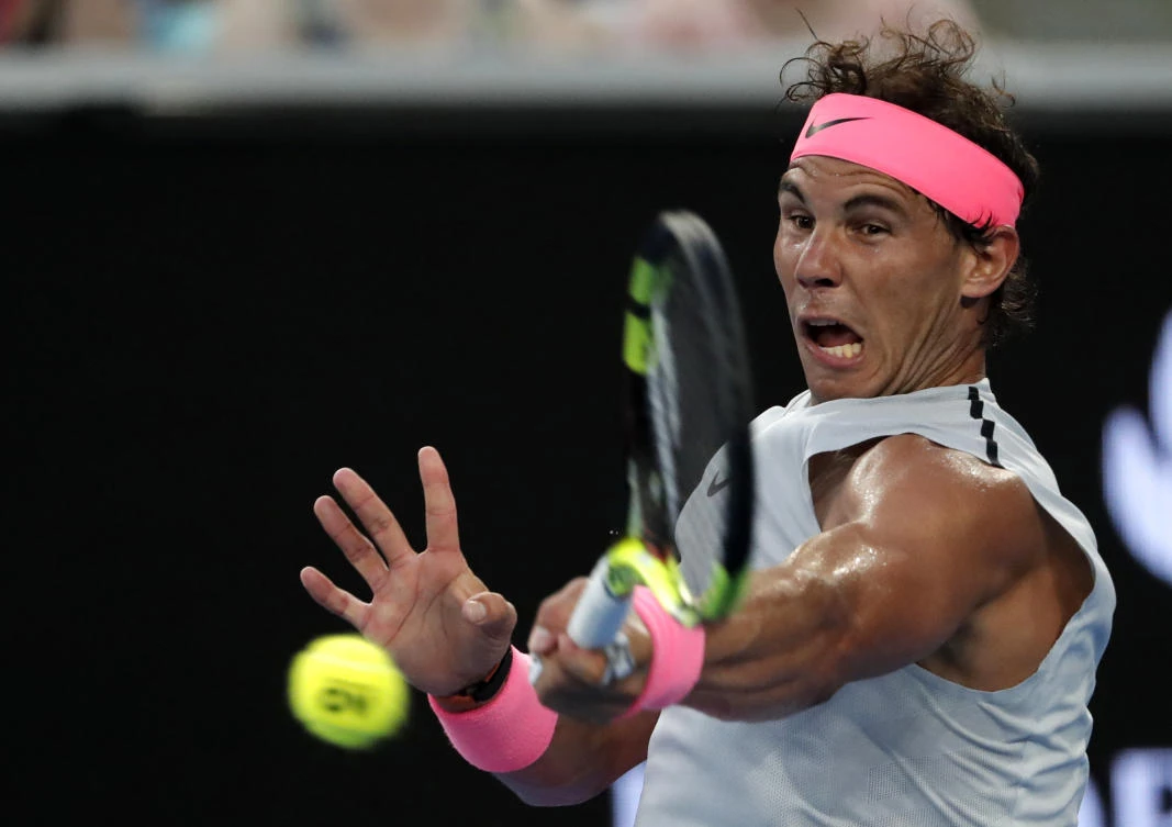 Spain's Rafael Nadal hits a forehand return to Damir Dzumhur of Bosnia and Herzegovina during their match at the Australian Open tennis championships in Melbourne. Nadal reached the fourth round in Australia for the 11th time with a 6-1, 6-3, 6-1 win over Dzumhur. (AP)