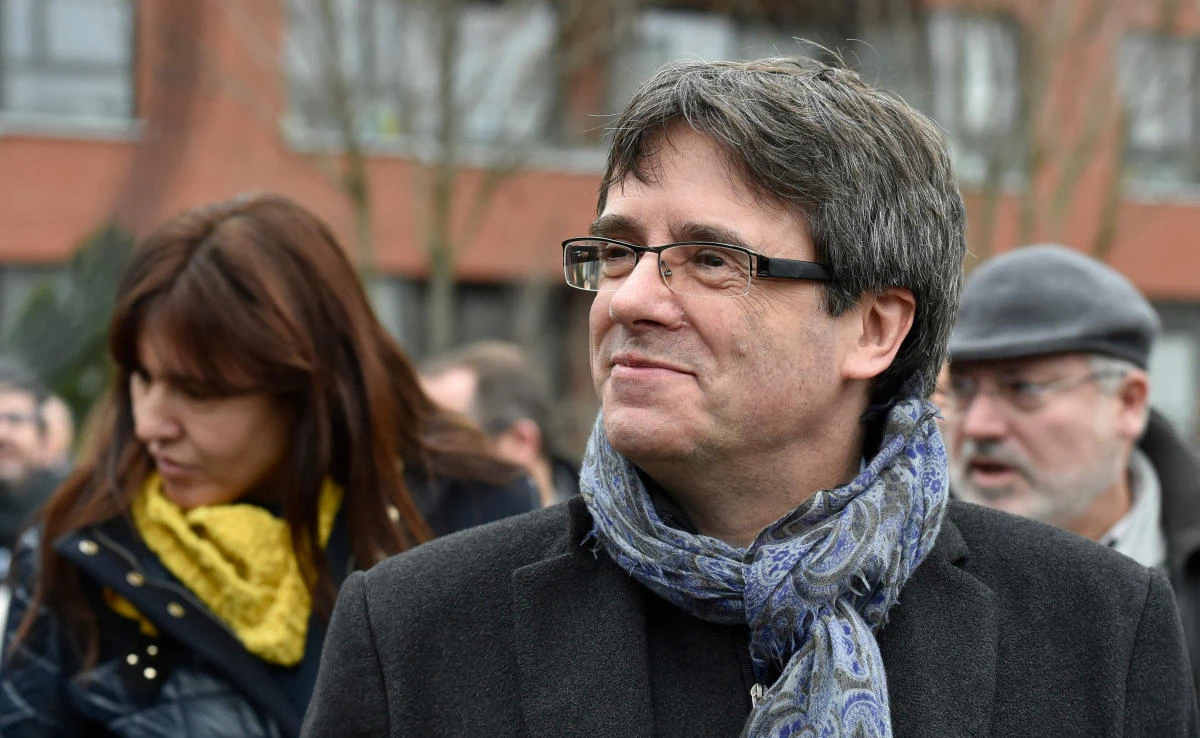 Catalonia’s ousted regional president Carles Puigdemont walks as he holds his first post-election meeting for members of his parliamentary group in Brussels on Jan. 12, 2018. (AFP)