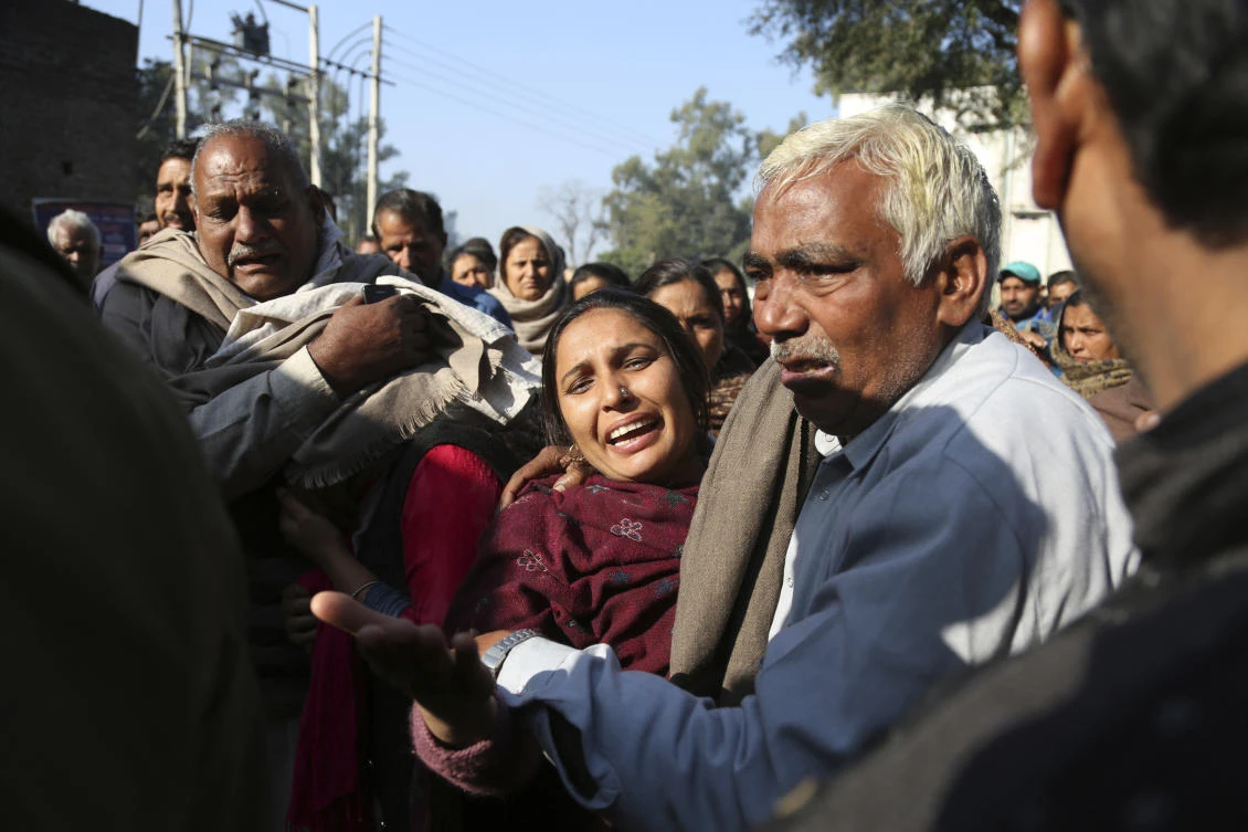 Relatives of Indian boy Sahil Kumar, who was killed in Pakistani firing and shelling, wail at a hospital in the disputed Himalayan region of Kashmir. (AP)