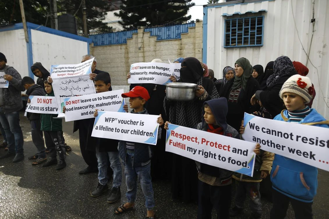 Palestinians take part in a protest against aid cuts outside of United Nations’ offices in Gaza City on January 17, 2018. The UN agency for Palestinian refugees faces its worst funding crisis ever after the United States froze tens of millions of dollars in contributions. (AFP)