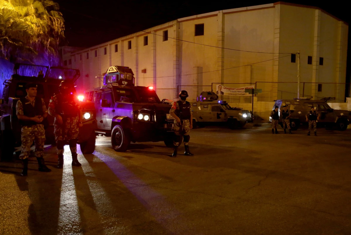 Security forces stand guard outside the Israeli embassy in the residential Rabiyeh neighborhood of the Jordanian capital Amman following an ‘incident’ on July 23, 2017. A Jordanian was killed and an Israeli seriously wounded at the Jewish state’s embassy in Amman. (AFP)