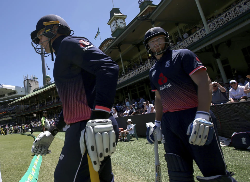 England’s opening batsmen Jonny Bairstow, right, and Jason Roy run out to start their one day international cricket match against Australia in Sydney, Sunday, Jan. 21, 2018. (AP)
