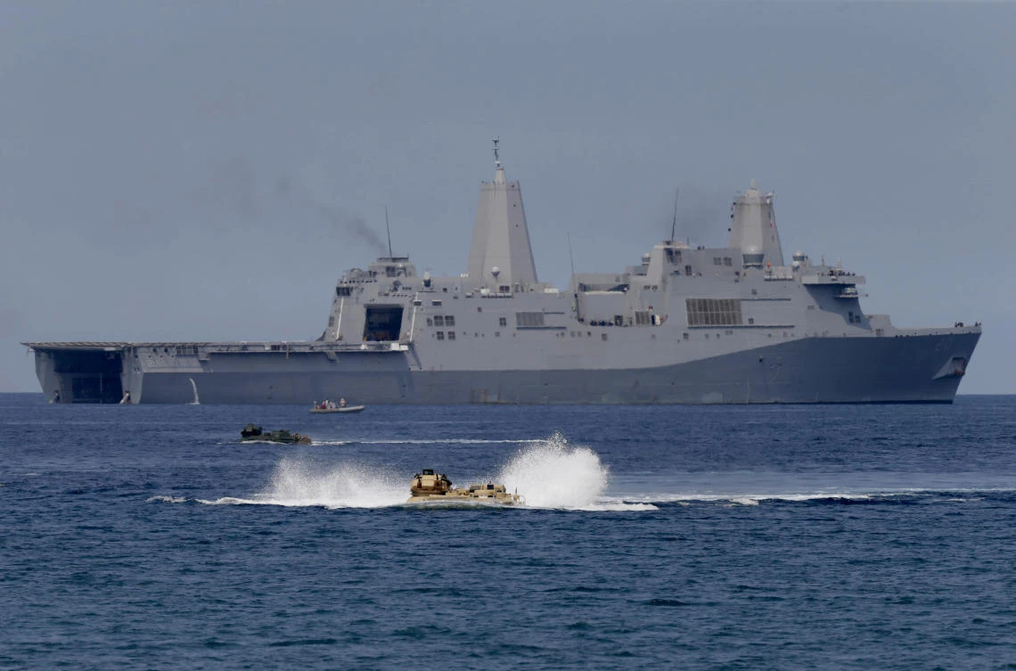 US Navy’s amphibious assault vehicles with Philippine and US troops on board maneuver in the waters during a combined assault exercise facing the contested Scarborough Shoal in waters off of the Philippines. (AP)
