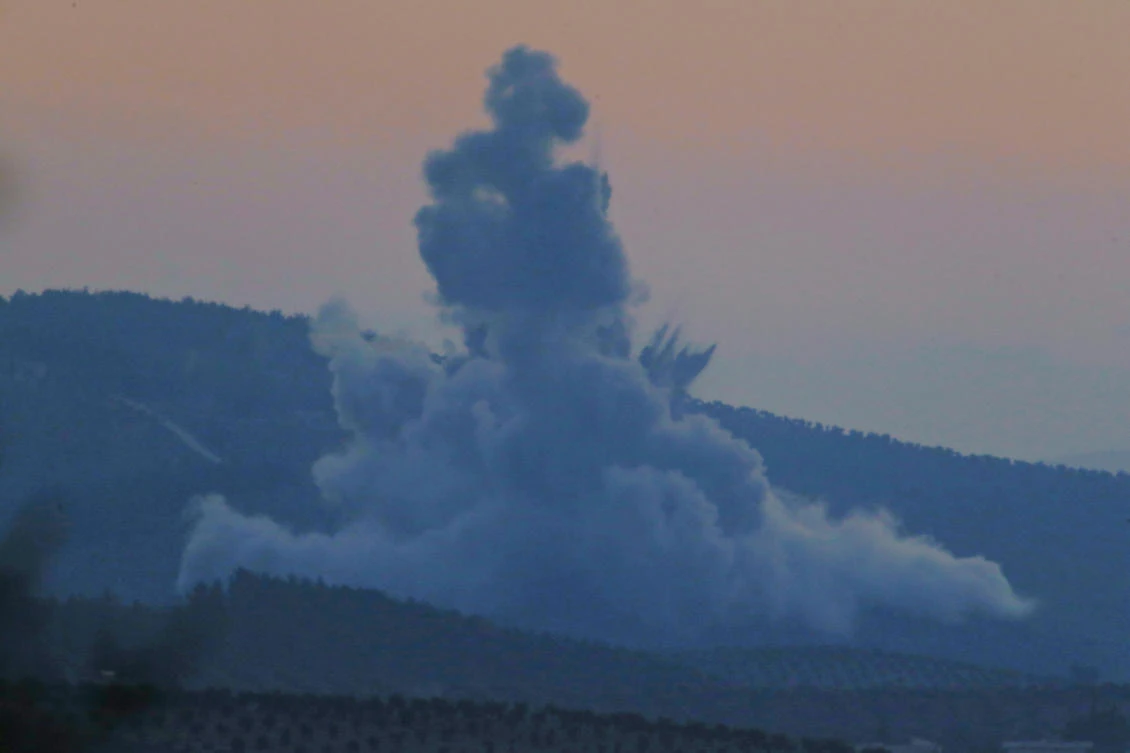 Plumes of smoke and dirt rise on the air from inside Syria, as seen from the outskirts of the border town of Kilis, Turkey. Turkish jets have begun an aerial offensive, codenamed operation "Olive Branch", against the Syrian Kurdish-held enclave of Afrin. (AP)