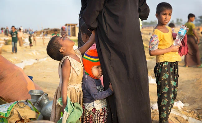 A relocated Rohingya refugees family waits to get allotted a temporary shelter at Balukhali refugee camp, 50 kilometres from, Cox's Bazar, Bangladesh, in this Jan. 17, 2018 photo. (AP)
