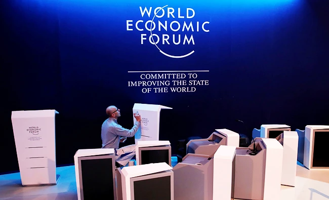 A staff checks elements of the stage ahead of the World Economic Forum (WEF) annual meeting in the Swiss Alps resort of Davos, Switzerland on Sunday. (REUTERS)