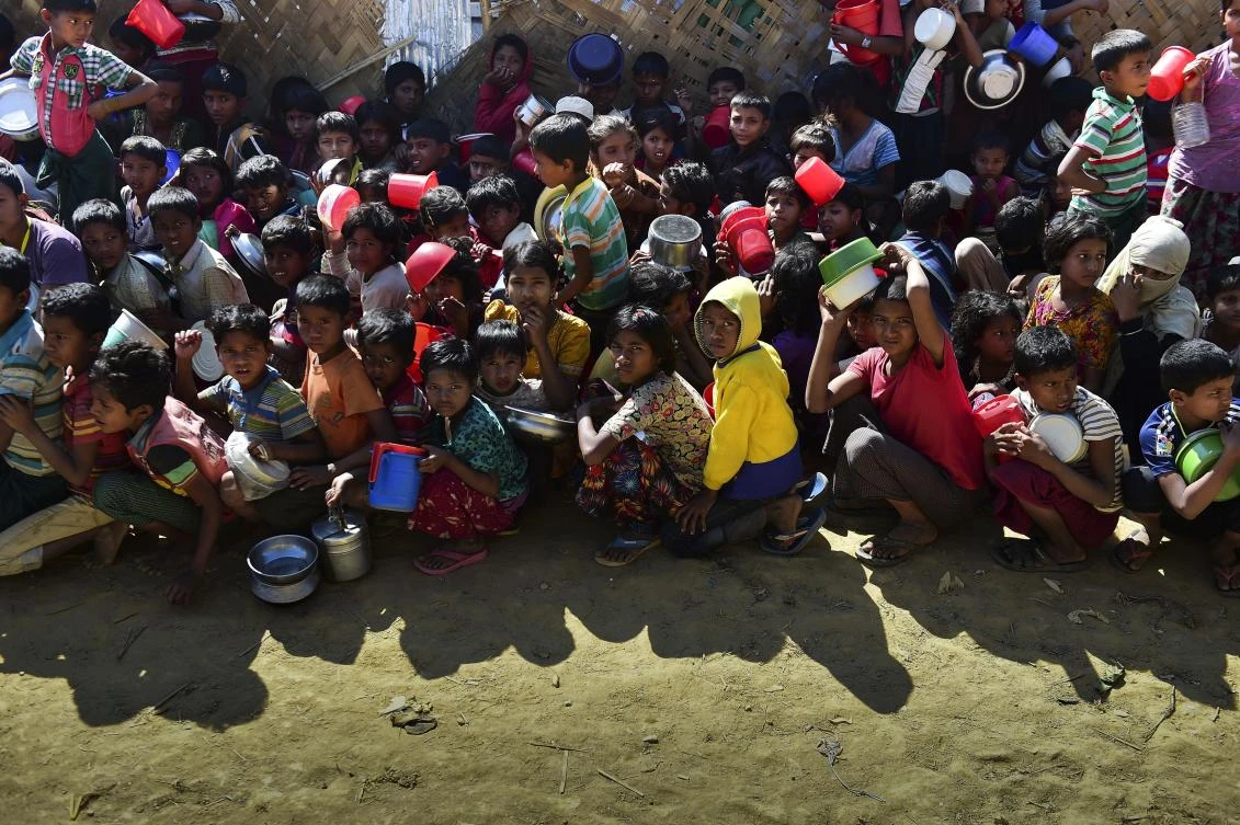 Above, Rohingya refugees wait for food aid at Thankhali refugee camp in Bangladesh’s Ukhia district. Rights groups and the UN have said any repatriation of the Rohingya, who face desperate conditions in overcrowded camps near the countries’ shared border, must be voluntary. (AFP)