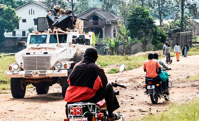 A South African armored personnel carrier belonging to the United Nations mission in the Democratic Republic of Congo (MONUSCO) patrols in the streets of Munzambayi, near Beni, on January 15, 2018. (AFP)