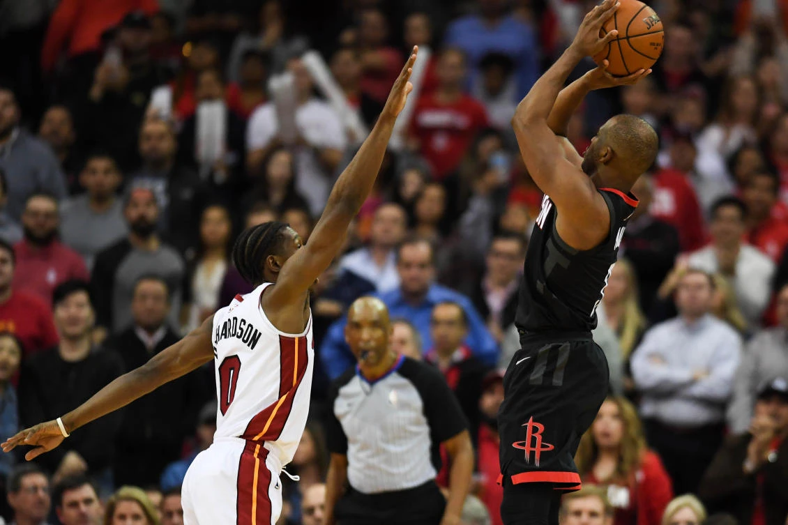 Houston Rockets guard Chris Paul (3) shoots a three-pointer over Miami Heat forward Josh Richardson (0) during the fourth quarter at Toyota Center. (Shanna Lockwood-USA TODAY Sports)
