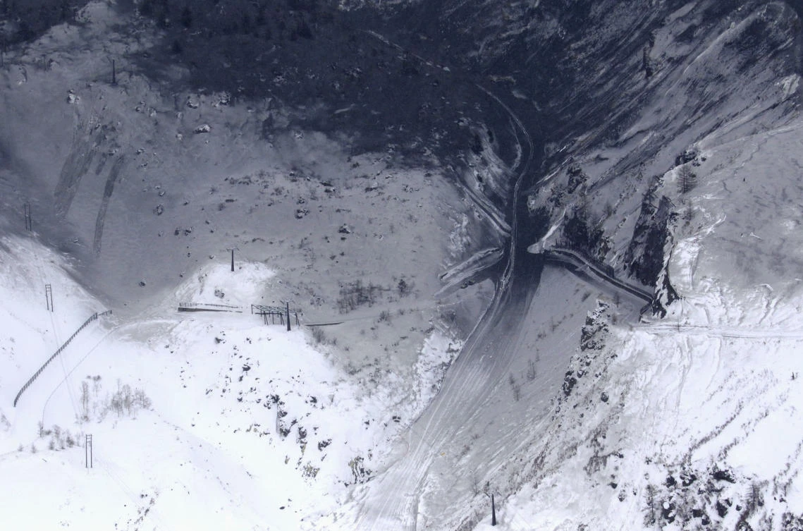 Volcanic ash covers the slopes of a ski resort in Kusatsu, Gunma prefecture, central Japan, after Mount Kusatsu-Shirane erupted Tuesday, Jan. 23, 2018. A disaster official said the volcano erupted and caused avalanche near the ski resort. (Suo Takekuma/Kyodo News via AP)