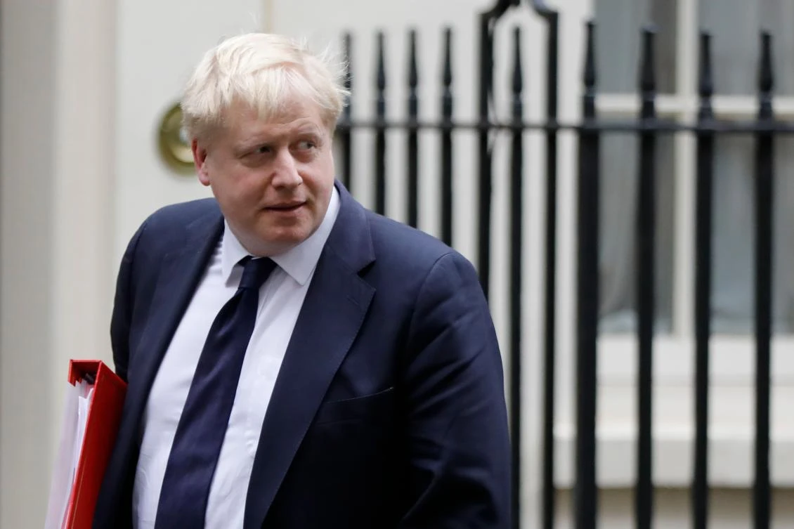 Britain’s May slaps down foreign minister over health funds