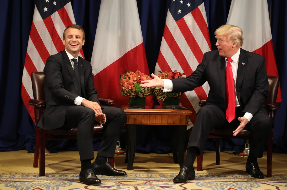 France's president Emmanuel Macron (L) laughing with US President Donald Trump. (AFP)