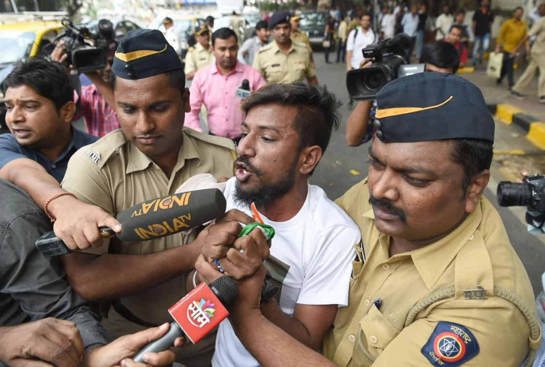 A member of a caste-based group Rajput Karni Sena is detained by the police during a demonstration against the Bollywood film 'Padmavati' outside the office of Central Board of Film Certification (CBFC) in Mumbai. (AFP)