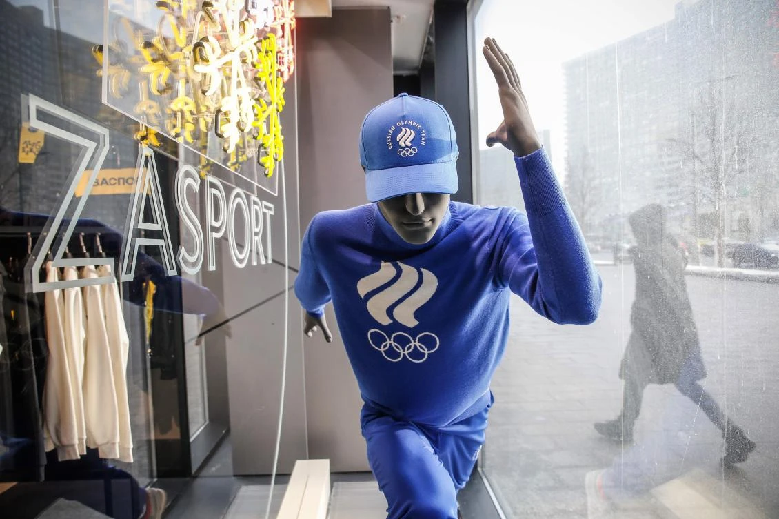 A man walks past a Russian sportswear outlet shop called Zasport, the company who designed the IOC-approved uniforms for the Russian Olympic Athletes. The IOC banned Russia from the Games in South Korea for “unprecedented systematic manipulation” of the anti-doping system. (AFP)