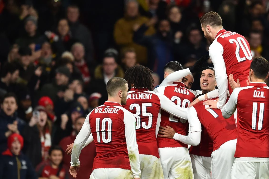 Arsenal players celebrate as they scored against Chelsea. The Gunners will face Manchester City in the League Cup Final. (AFP)