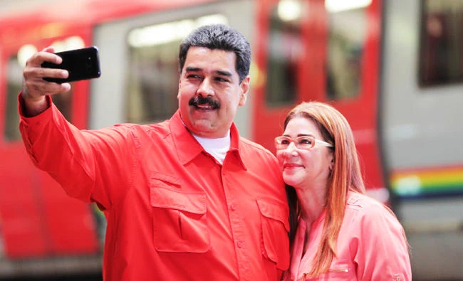 Venezuela's President Nicolas Maduro takes a selfie next to his wife Cilia Flores. (Miraflores Palace via Reuters)