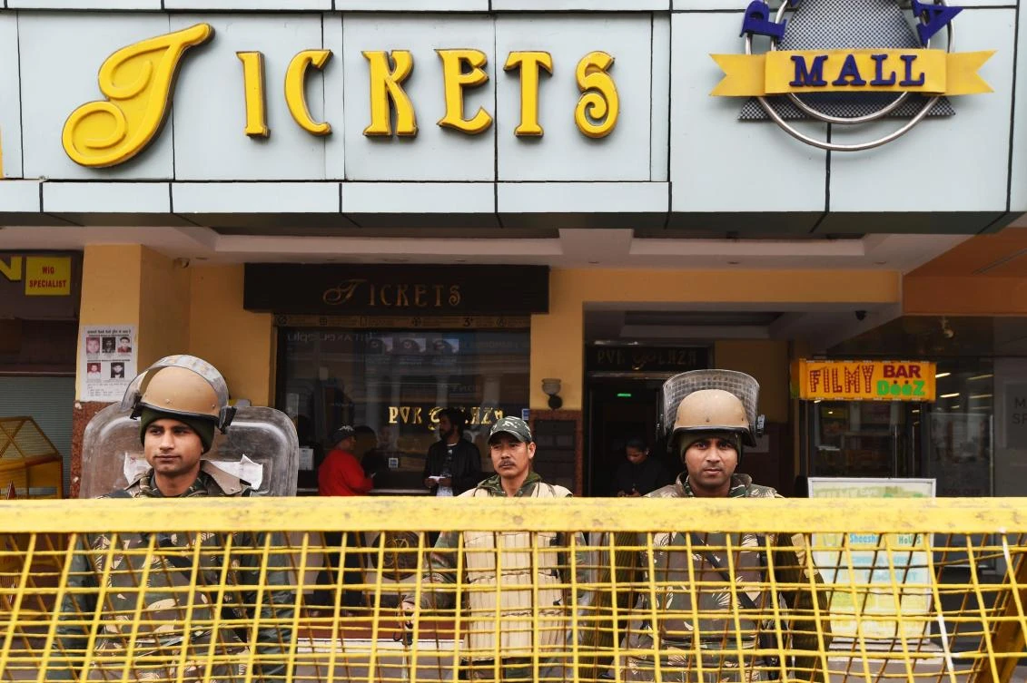 Indian riot police stand guard at the entrance of a cinema hall scheduled to screen Bollywood film ‘Padmaavat’ in New Delhi on Thursday, January 25. The movie was initially due to hit screens on December 1 but filmmakers pushed back the release because of the controversy. (AFP)
