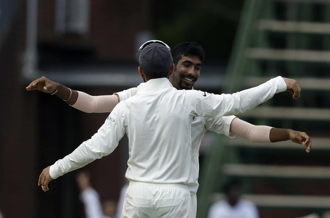 India's bowler Jasprit Bumrah, facing camera, celebrates with captain Virat Kohli, after dismissing South Africa's batsman Lungi Ngidi. (AP)
