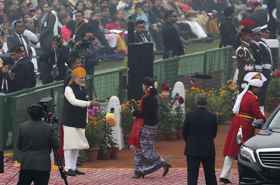 Indian Prime Minister Narendra Modi, left, welcomes Myanmar State Counsellor Aung San Suu Kyi during the Republic Day parade in New Delhi. (AP)