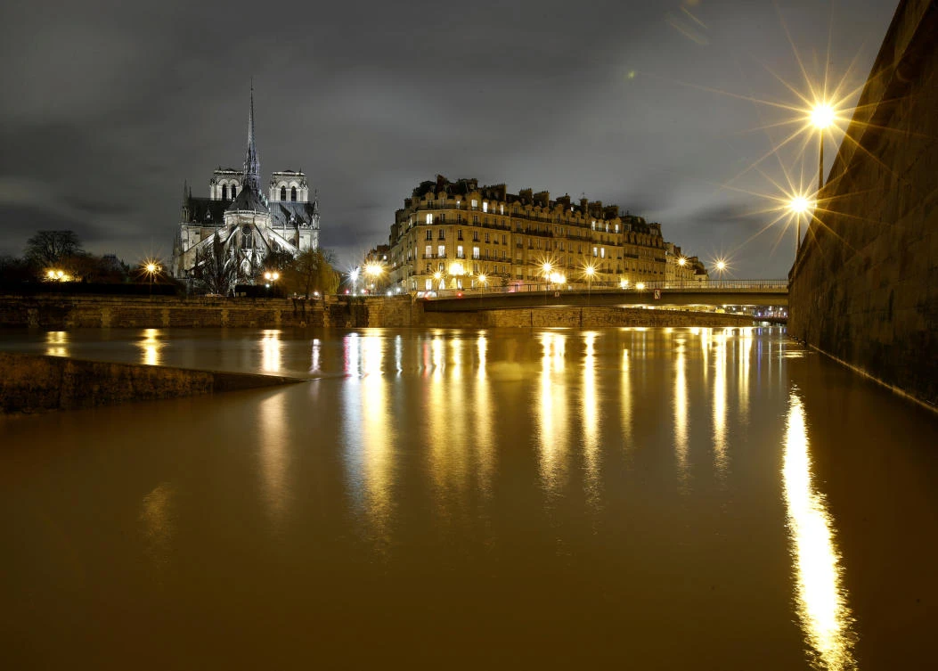 A view of Notre Dame Cathedral at night. Paris hopes to attract financial groups away from London after Brexit. (Reuters)