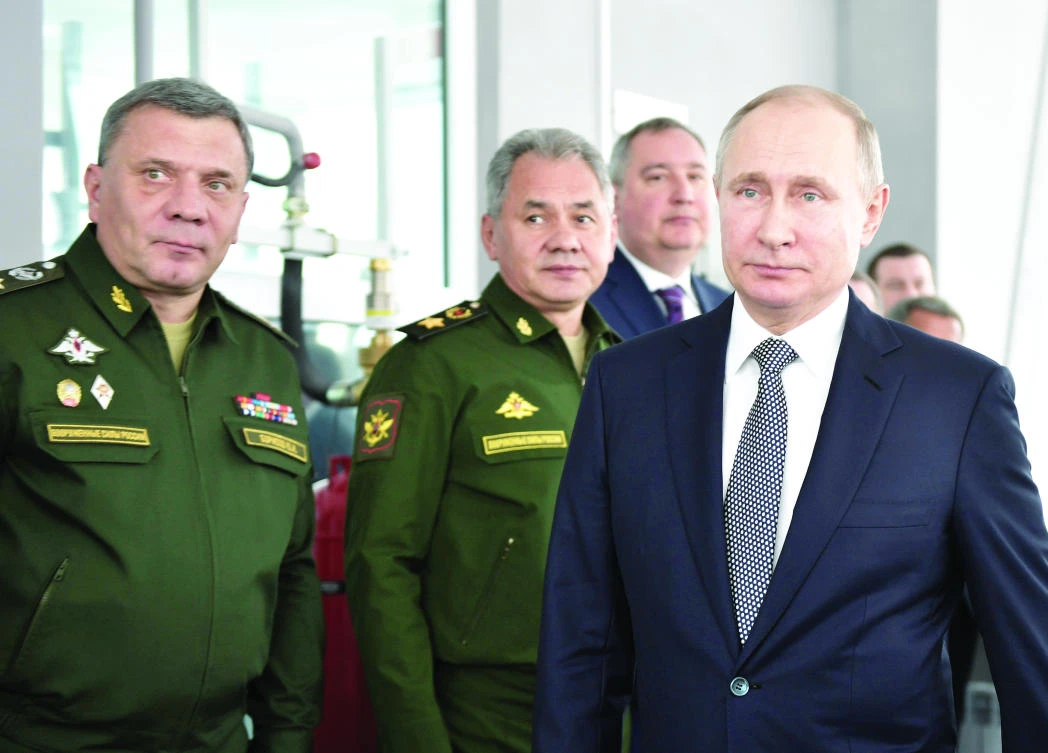 Russian President Vladimir Putin, Defense Minister Sergei Shoigu and Deputy Defense Minister Yuri Borisov visit the Gorbunov Aviation factory in Kazan, Russia, on Thursday. (Reuters)