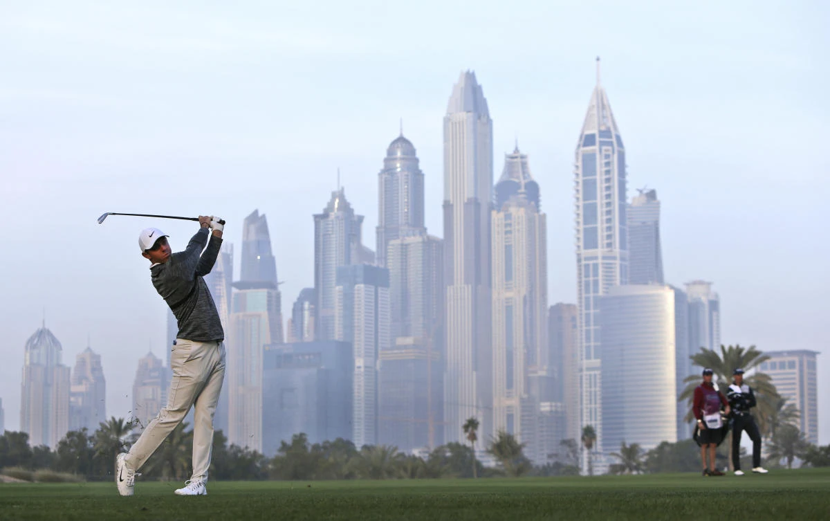 Northern Ireland’s Rory McIlroy plays a shot on the 13th hole during the second round, which was delayed due to fog on Friday, of the Dubai Desert Classic golf tournament in Dubai, United Arab Emirates, Saturday, Jan. 27, 2018. (AP)