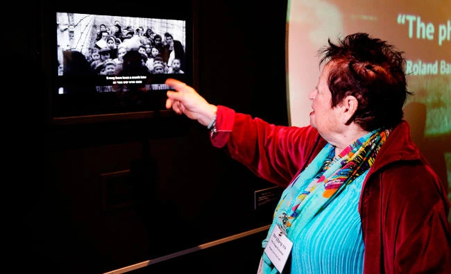 Israeli holocaust survivor from Auschwitz Vera Kriegel Grossman points at herself in a film showing the liberation of the Nazi death camp Auschwitz by the Red Army in 1945 on January 24, 2018 displayed at a new photography exhibition "Flashes of Memory: Photography during the Holocaust" at the Yad Vashem memorial in Jerusalem commemorating the six million Jews murdered by the Nazis during WWII. (AFP)