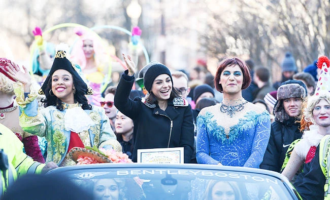 Actress Mila Kunis waves next to Theatricals President Amira Weeks (L) and Vice President Jacques Berguig (R) during the Hasty Pudding parade to honor Kunis as Hasty Pudding Theatricals 2018 Woman of the Year at Harvard University in Cambridge, Massachusetts, U.S., in this January 25, 2018 photo. (REUTERS)