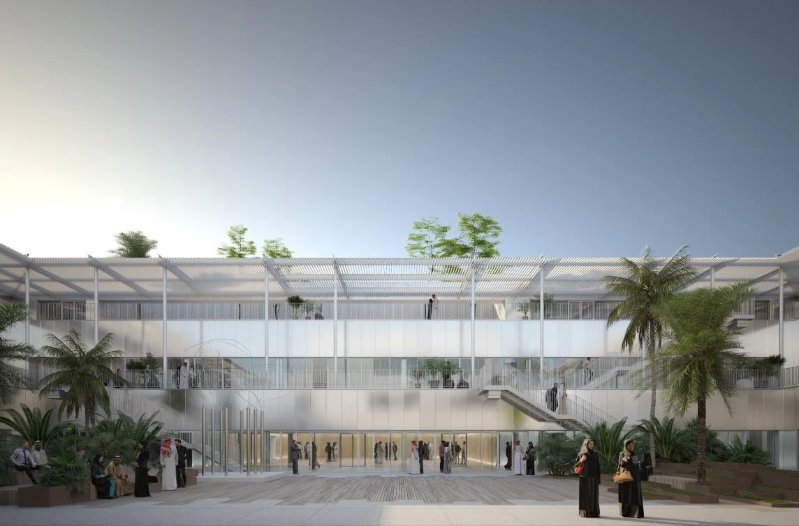 The three-story contemporary development features open internal courtyards surrounded by shaded terraces and walkways.