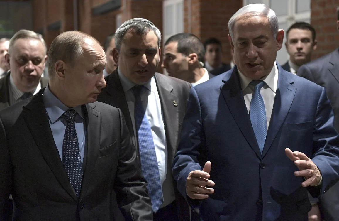 Russian President Vladimir Putin and Israeli Prime Minister Benjamin Netanyahu at the 75th anniversary of the Sobibor uprising the only successful uprising that took place in a death camp during World War II at the Jewish Museum and Tolerance Center in Moscow. (AP)