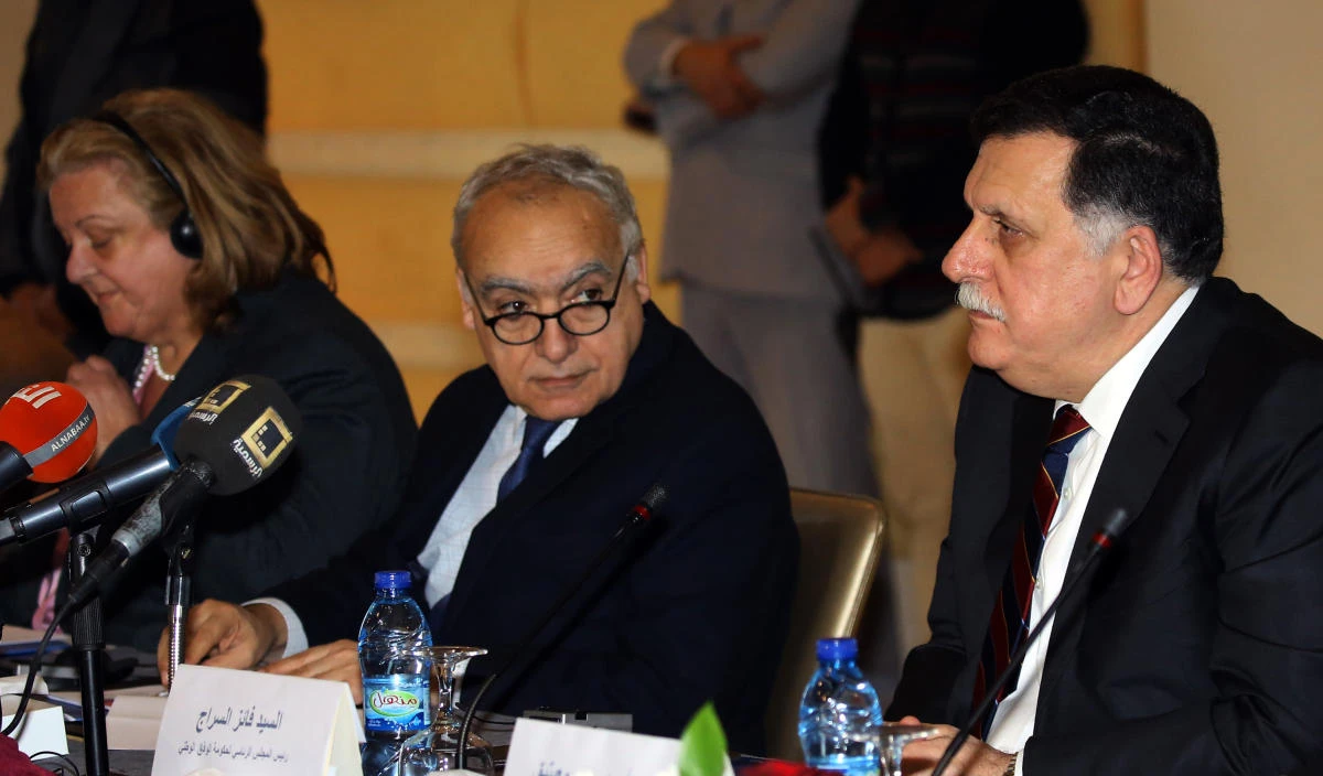 UN Humanitarian Coordinator for Libya Maria Ribeiro (L), UN special representative and head of the UN support mission in Libya (UNSMIL) Ghassan Salame (C) and Libya's unity government Prime Minister Fayez al-Sarraj attend an event to announce the official launch of the 2018 Libya Humanitarian Response Plan, in Tripoli on January 25, 2018. (AFP)