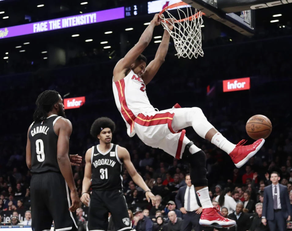 Miami Heat’s Hassan Whiteside (21) dunks in front of Brooklyn Nets’ Jarrett Allen (31) and DeMarre Carroll (9) during the first half of an NBA basketball game Friday, Jan. 19, 2018, in New York. (AP)