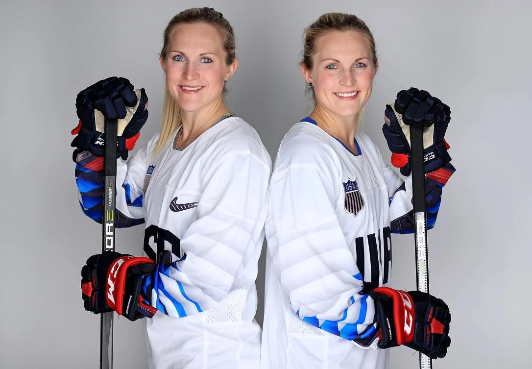 Monique Lamoureux-Morando #7 (L) and Jocelyne Lamoureux-Davidson #17 of the United States Women’s Hockey Team poses for a portrait in Wesley Chapel, Florida. (Mike Ehrmann/Getty Images/AFP)