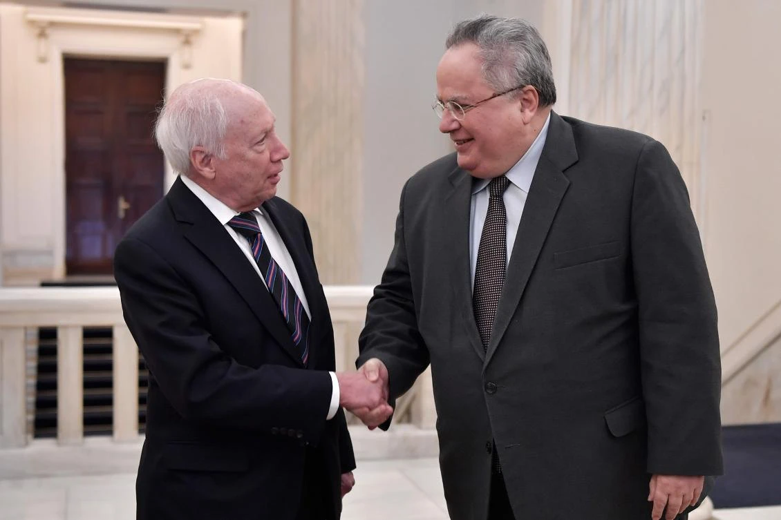 United Nations mediator Matthew Nimetz (L) shakes hands with Greek Foreign Minister Nikos Kotzias ahead of a meeting in Athens over the naming row with neighbouring Macedonia. Greece said it wanted Macedonia to adopt an 'untranslatable' name in order to settle a long-running dispute between the two countries. (AFP)