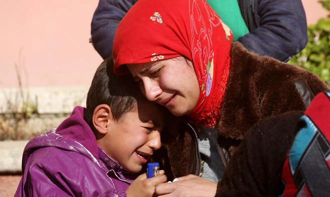 Relatives of a Kurdish herder mourn outside the hospital in Afrin on Jan. 28, 2018, after he was killed in a Turkish airstrike on their village near the Kurdish enclave. (AFP)