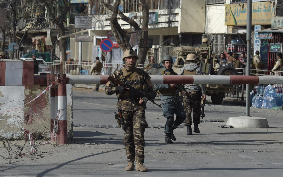 Afghan security personnel arrive at a site after a car bomb exploded near the old Ministry of Interior building in Kabul on January 27, 2018, killing at least 17 people and wounding 110 others, in an attack claimed by the Taliban. (AFP)