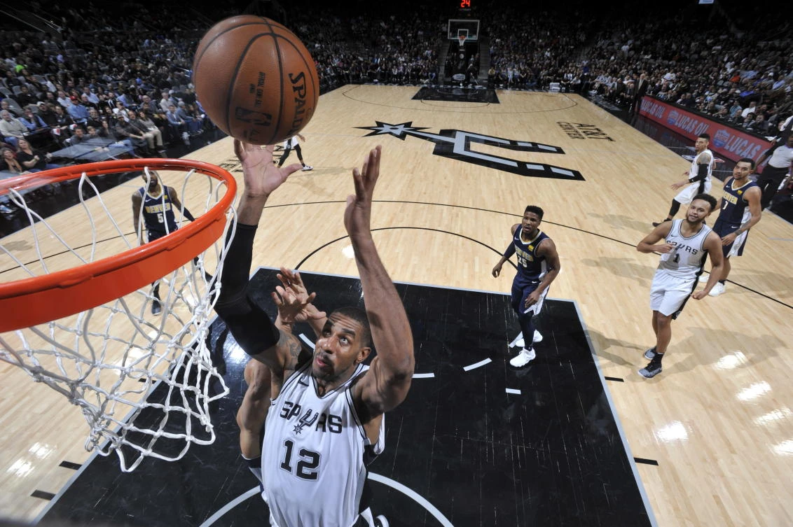 LaMarcus Aldridge #12 of the San Antonio Spurs handles the ball against the Denver Nuggets on January 30, 2018 at the AT&T Center in San Antonio, Texas. (Mark Sobhani/NBAE via Getty Images/AFP)