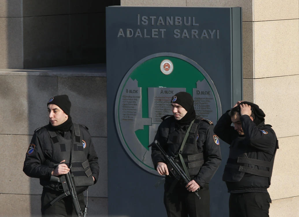 Turkish police officers guard a court in Istanbul, Wednesday, Jan. 31, 2018, with sign reading in Turkish: 'Justice Palace'. (AP)