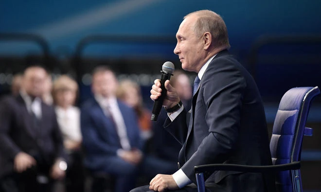 Russian President Vladimir Putin address his supporters during a meeting for his campaign in Moscow, on Tuesday. (AP)