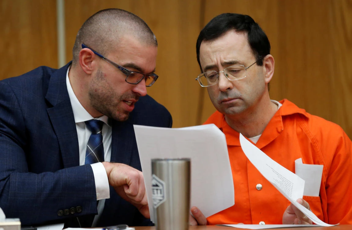 Larry Nassar, a former team USA Gymnastics doctor who pleaded guilty in Nov. 2017 to sexual assault, talks with his attorney Matt Newburg during Nassar’s sentencing hearing in the Eaton County Circuit Court in Charlotte, Michigan, US, Jan. 31, 2018. (Reuters/Rebecca Cook)