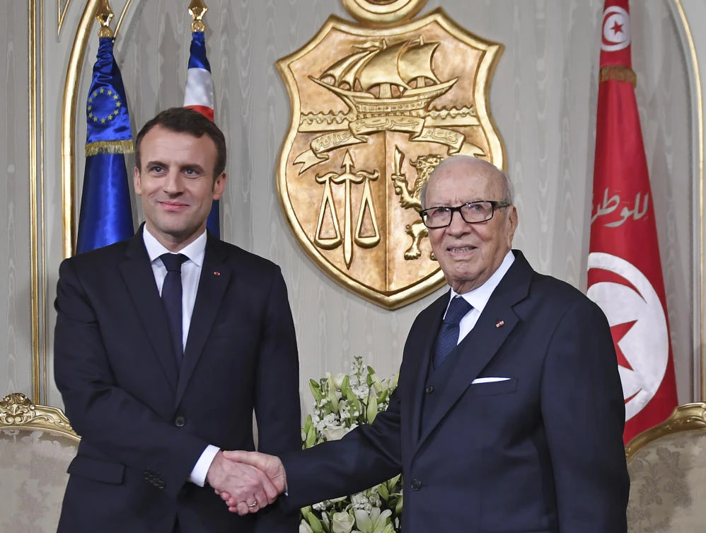 French President Emmanuel Macron, left, is welcomed by Tunisian President Beji Caid Essebsi at Presidential Palace in Carthage, Tunisia, Wednesday, Jan. 31, 2018. French President Emmanuel Macron is in Carthage to sign a joint accords with Tunisian President Beji Caid Essebsi. (Eric Feferberg/AP)