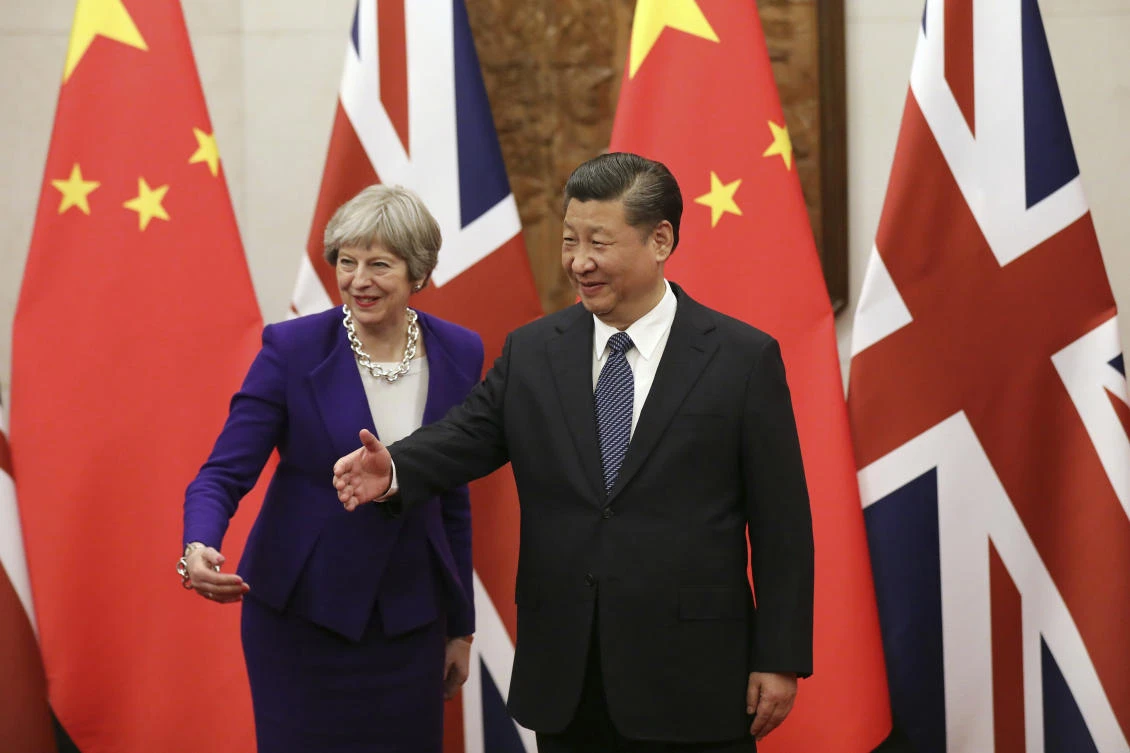 Chinese President Xi Jinping and British Prime Minister Theresa May gesture ahead a meeting at the Diaoyutai State Guesthouse in Beijing. (AP)
