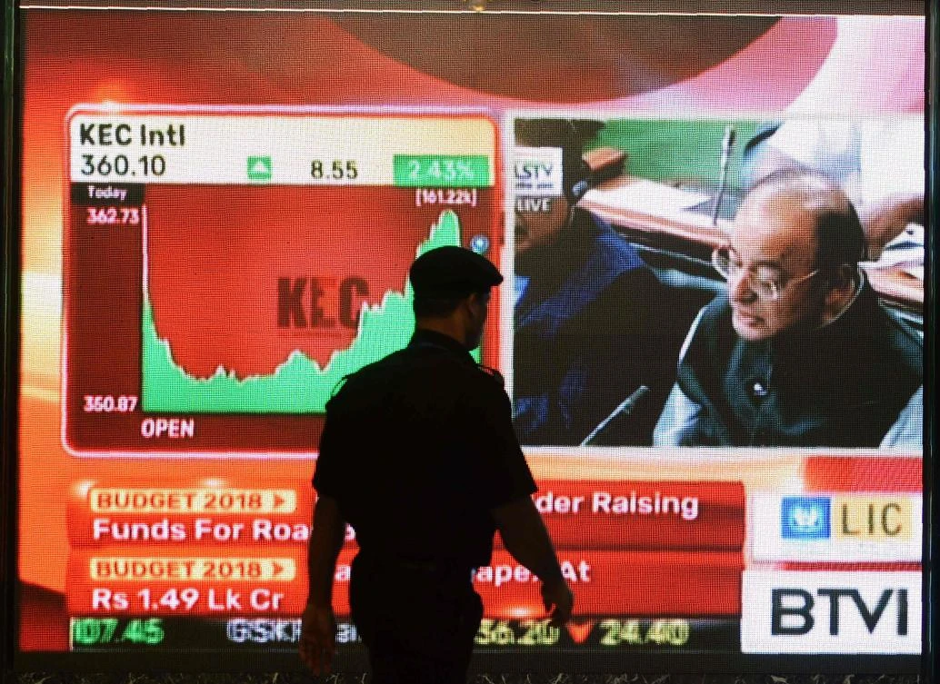 A screen in the Bombay Stock Exchange shows Finance Minister Arun Jaitley delivering his budget speech to Parliament. India promised hundreds of billions of dollars to develop poor rural areas and to help struggling farmers. (AFP)
