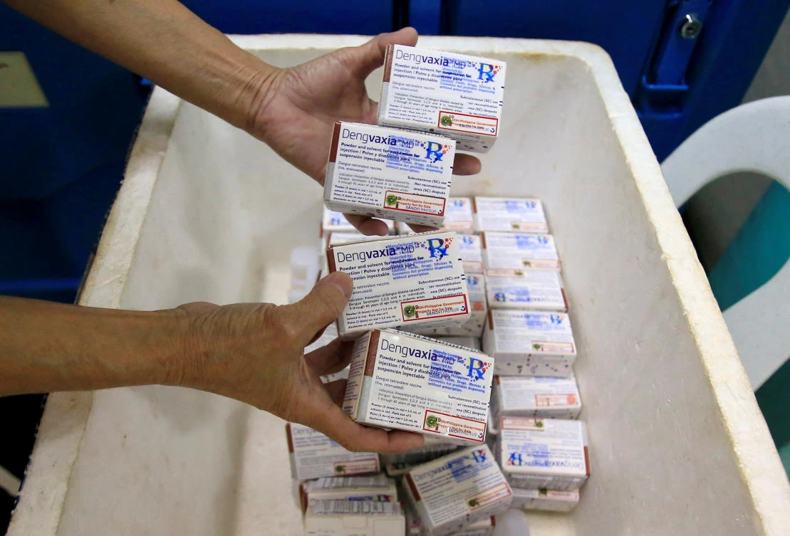 Above, a health worker shows unused packs of anti-dengue vaccine Dengvaxia from Sanofi Pasteur in Manila. The Philippines halted its immunization drive in December after Sanofi said a study showed the vaccine may increase the risks of dengue in people vaccinated prior to infection. (Reuters)
