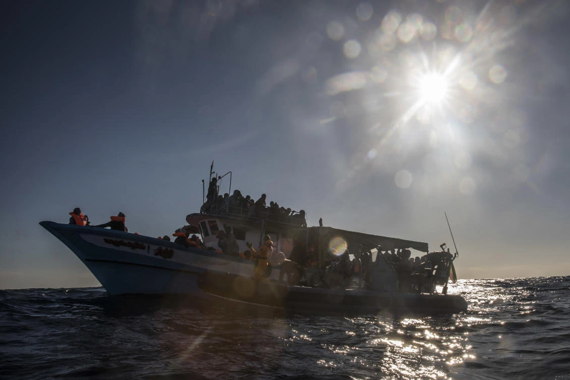 In this Saturday Jan. 27, 2018, photo, 329 refugees and migrants, mostly from Eritrea and Bangladesh, wait to be rescued by aid workers of the Spanish NGO Proactiva Open Arms, after leaving Libya trying to reach European soil aboard an overcrowded wooden boat, 45 miles north of Al-Khums, Libya. (AP)
