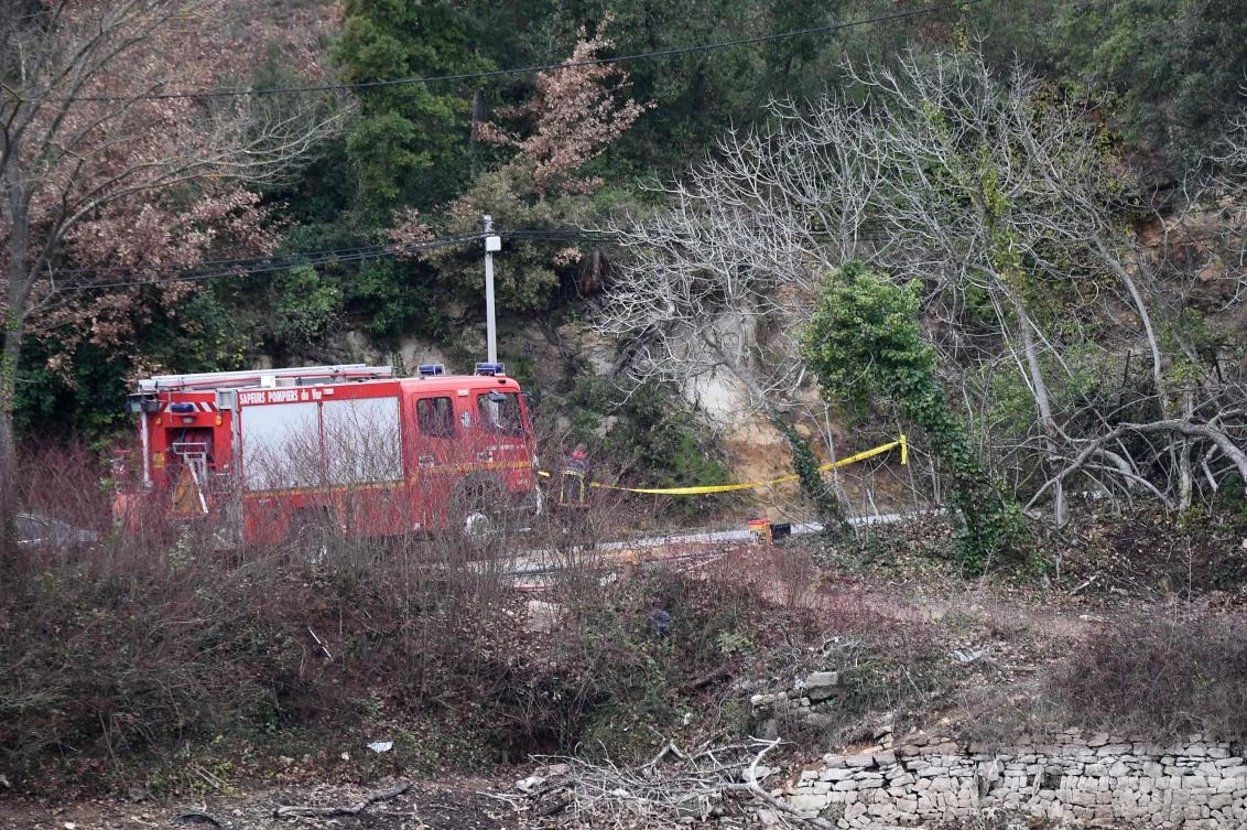 Firefighters work at the site of an accident near Carces lake, about 50 kilometres (30 miles) northwest of the resort of Saint-Tropez, on February 2, 2018, as the area is cordoned off after two army helicopters crashed into each other. (AFP)