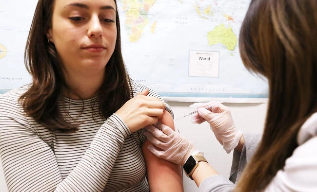 Simone Groper receives a flu shot at a Walgreens phramacy on January 22, 2018 in San Francisco, California. (AFP)