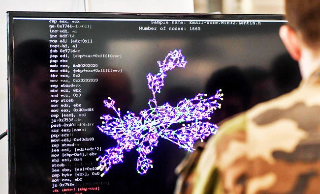 A member of the military specialised in cyber defense works on a computer during the 10th International Cybersecurity Forum in Lille, in this January 23, 2018 photo. (AFP)