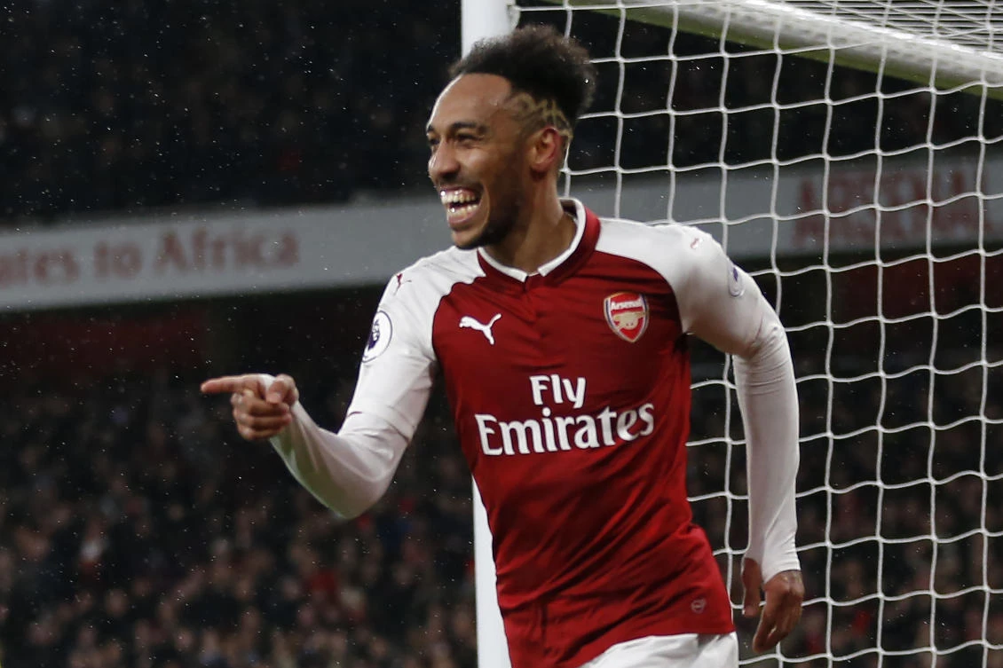 Arsenal's Gabonese striker Pierre-Emerick Aubameyang celebrates scoring on his debut and the team's fourth goal during the English Premier League football match between Arsenal and Everton at the Emirates Stadium in London. (AFP)