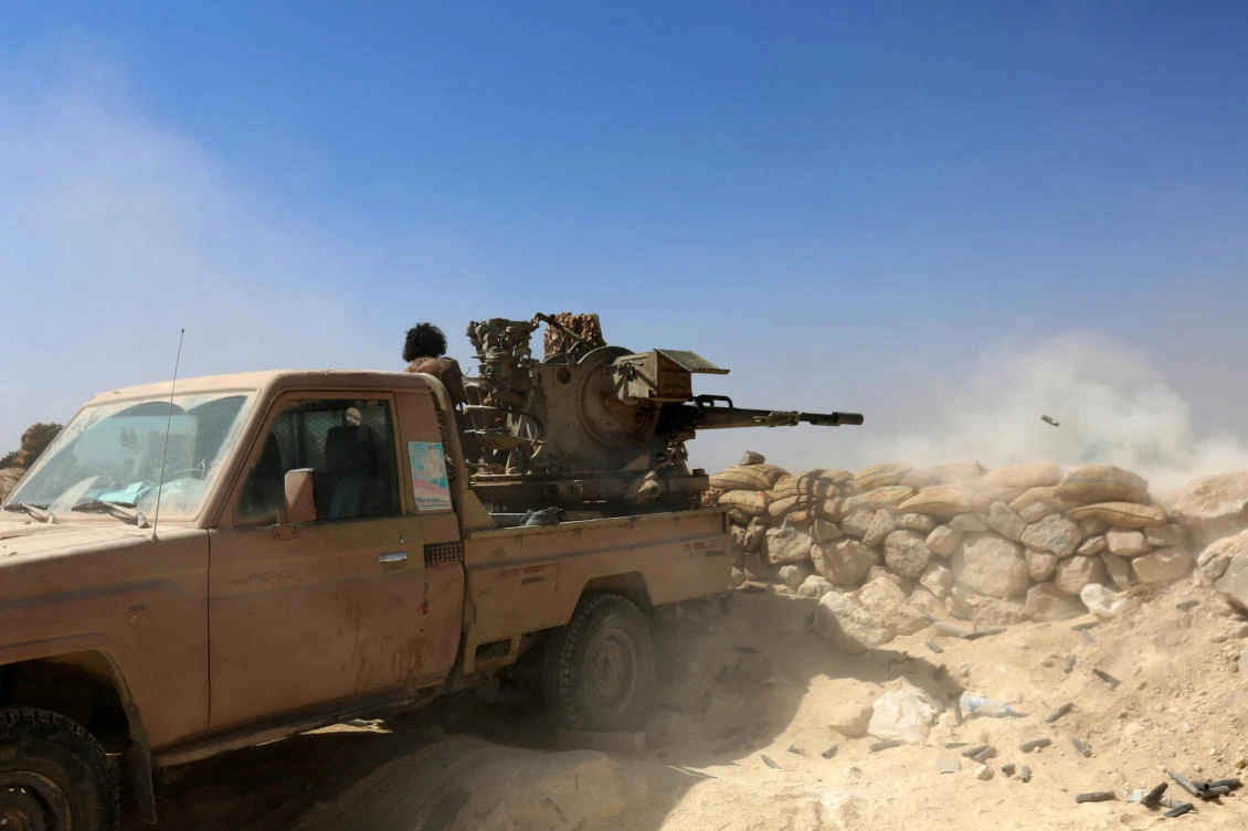 Yemeni tribesmen from the Popular Resistance Committees, who support forces loyal to the Saudi-backed Yemen president, fire towards Houthi terrorists. (AFP)